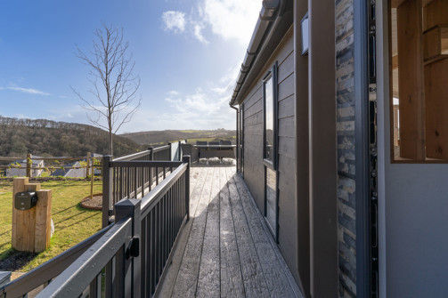 External of lodge looking down the side of the lodge along the decking