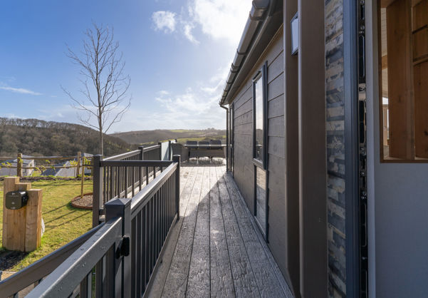 External of lodge looking down the side of the lodge along the decking