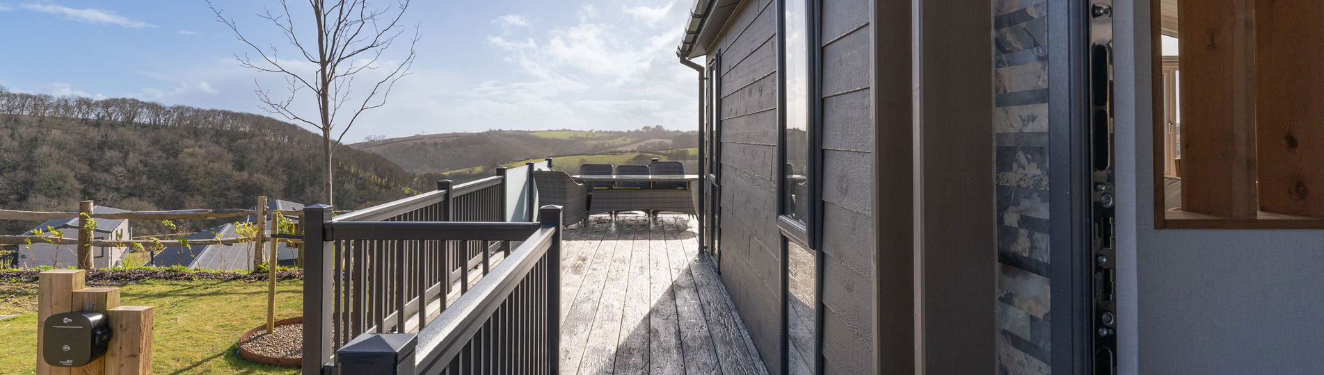 External of lodge looking down the side of the lodge along the decking