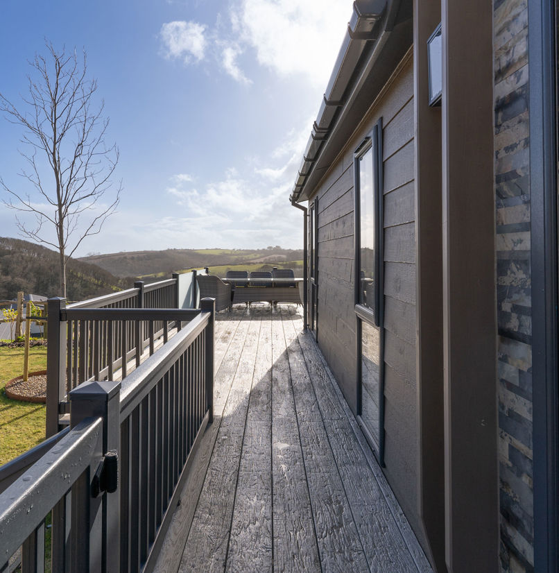 External of lodge looking down the side of the lodge along the decking