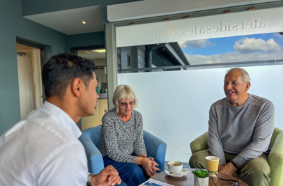 Couple talking with Sales Team Member on an Experience Day