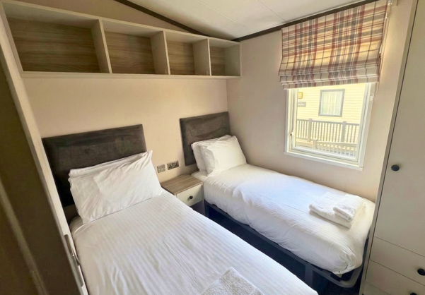 Internal of a caravan twin bedroom