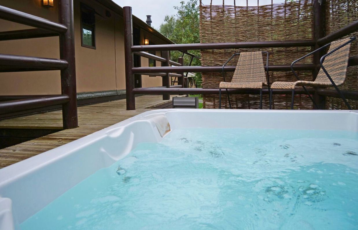 External of safari tent with hot tub