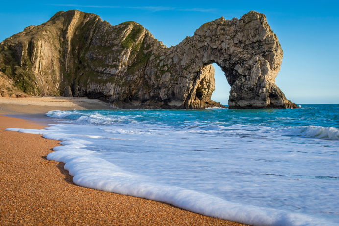An iconic limestone arch in the blue sea