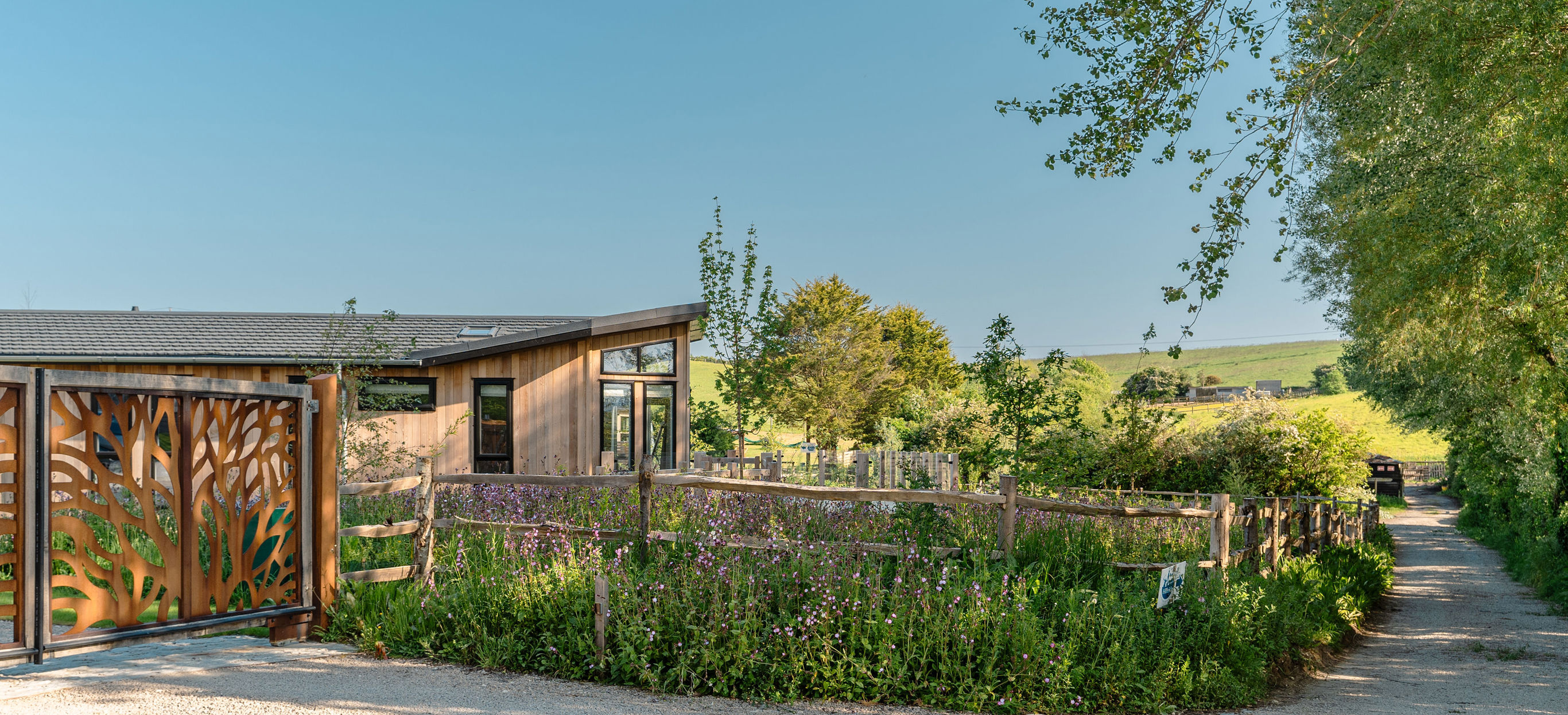 The gate at the front of The Stables luxury lodge development at Bowleaze Cove Holiday Park & Spa