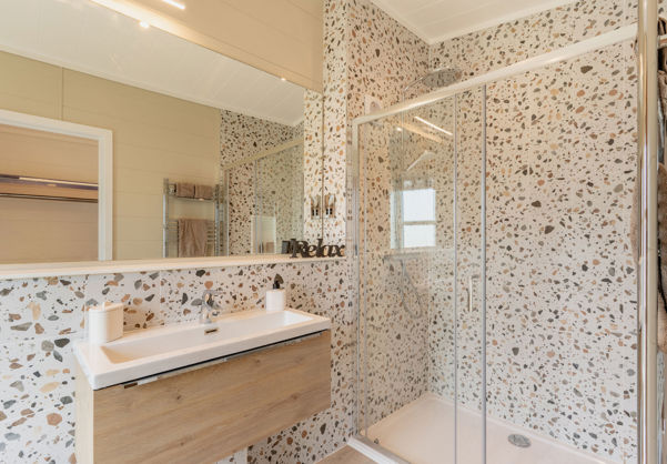 Internal of a luxury lodge ensuite bathroom with walk-in shower and sink