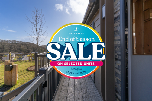 Image of a lodge among countryside with an end of season sale logo overlaid