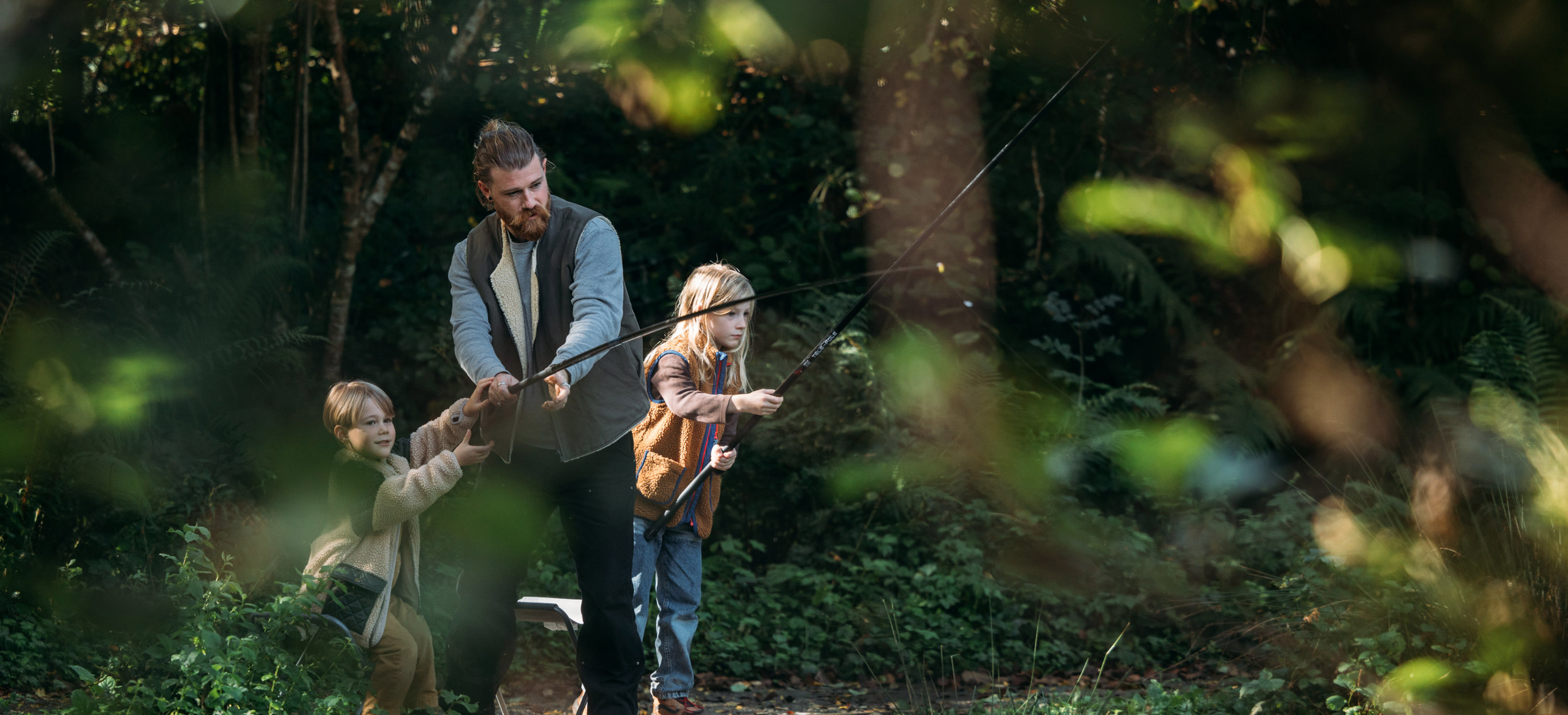 A Father and His Two Sons Fishing Among Nature at the Lake at Tregoad