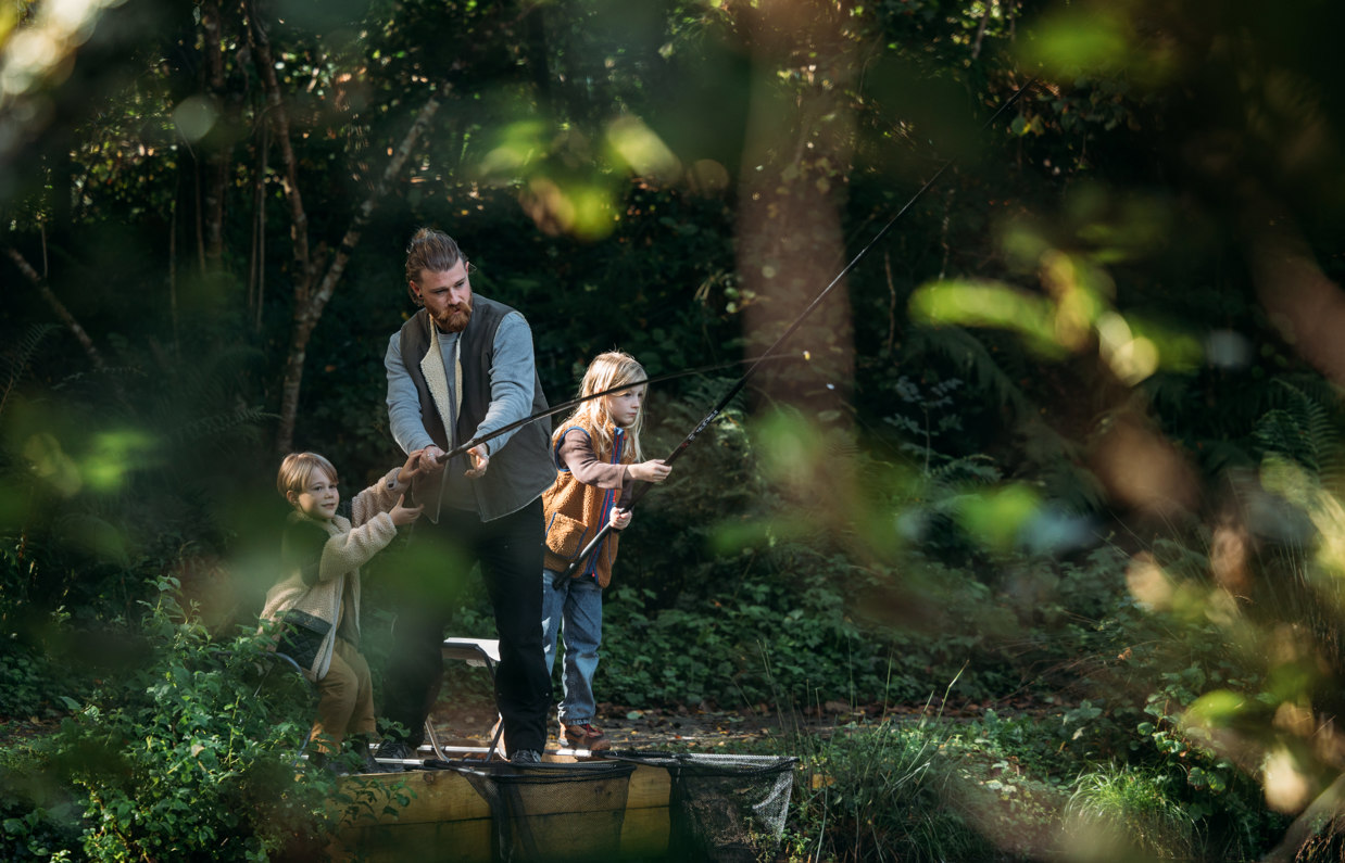 A Father and His Two Sons Fishing Among Nature at the Lake at Tregoad