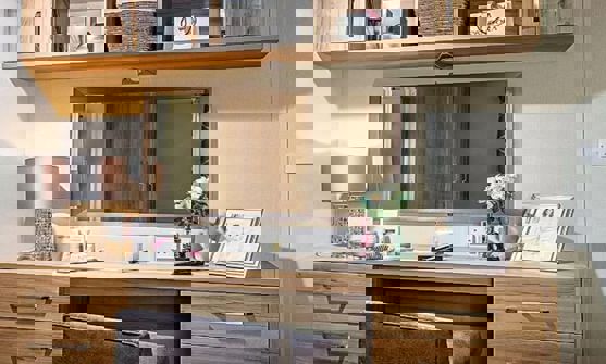 Modern vanity with drawers and overhead storage 