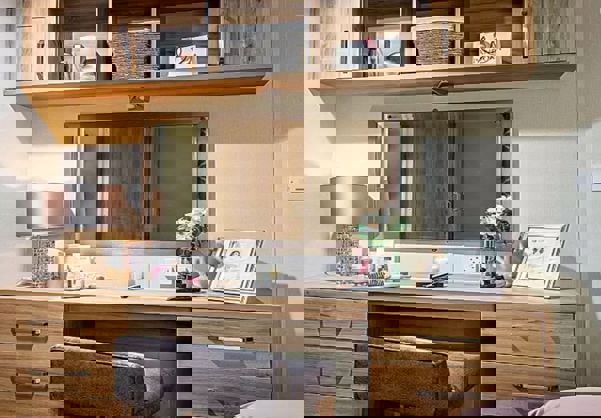 Modern vanity with drawers and overhead storage 