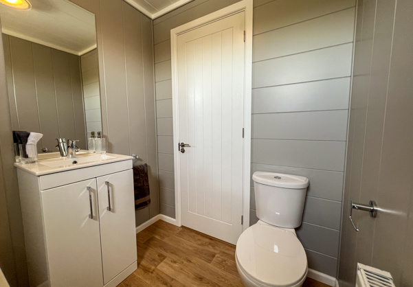 Internal of a luxury lodge bathroom with toilet and sink