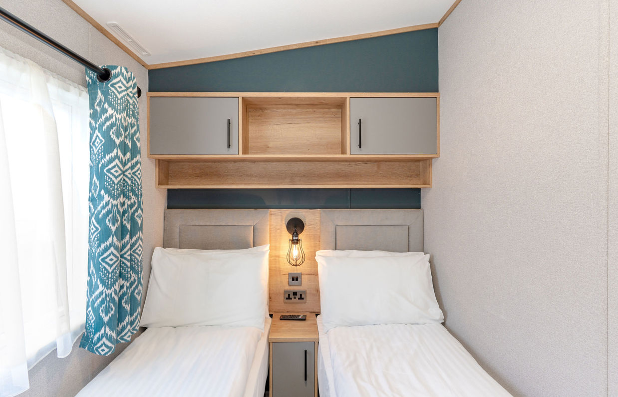 Internal of a caravan twin bedroom