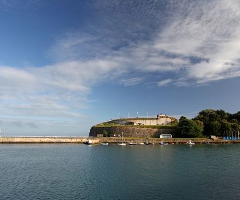 The Nothe Fort viewed from the sea on a blue sky day