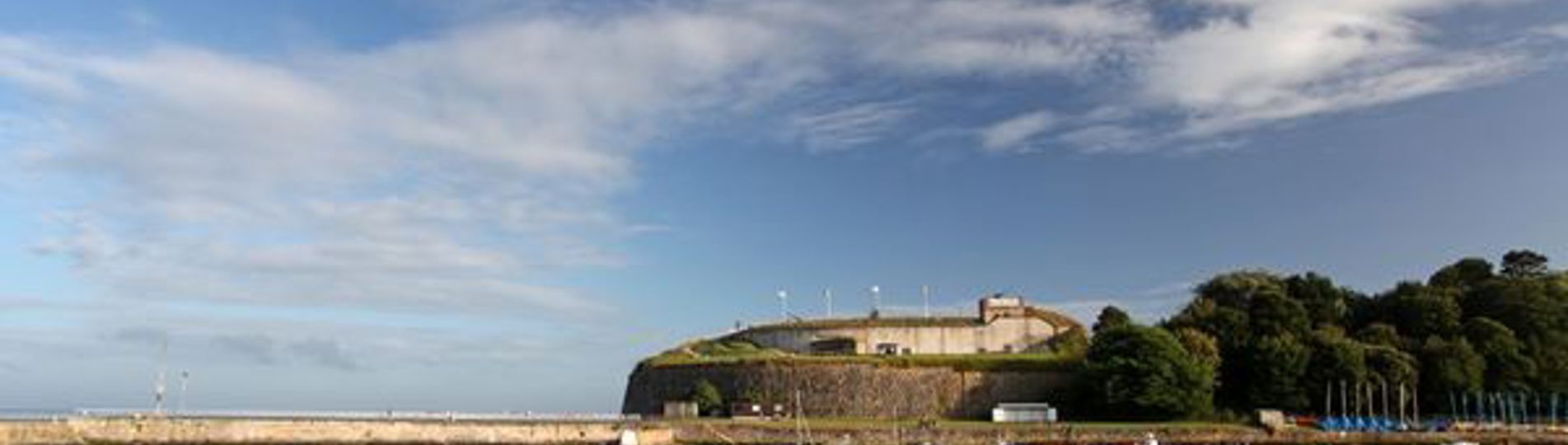 The Nothe Fort viewed from the sea on a blue sky day