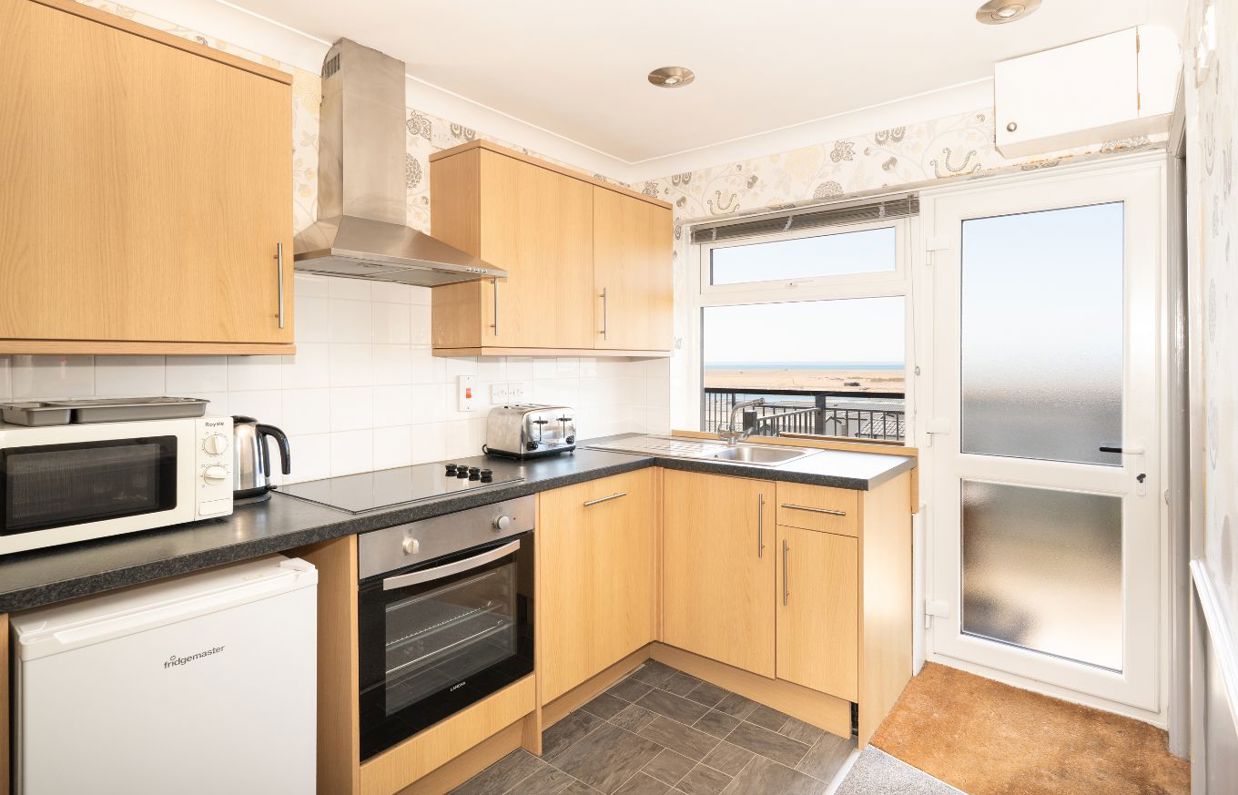 Open plan kitchen in Chesil Beach apartments with seaviews