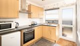 Open plan kitchen in Chesil Beach apartments with seaviews