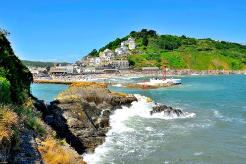 Coastal viewpoint looking back at town of Looe in Cornwall