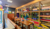 Internal of Arena Sports Bar soft play with adjacent tables and chairs