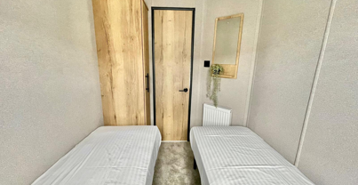 Internal of a caravan twin bedroom