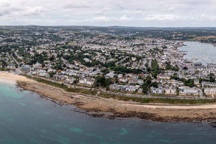 A bird's eye view of a coastal town with beaches