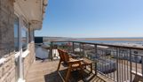 Views of Chesil Beach and the Jurassic Coast from the balcony of Chesil Beach apartments with outdoor furniture