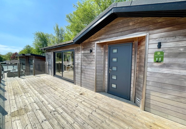 External of a luxury lodge on pitch with decking