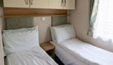 Internal of a caravan twin bedroom