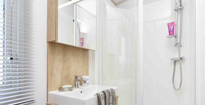 Internal of a caravan bathroom with shower and sink