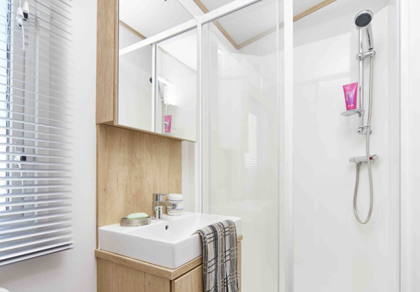 Internal of a caravan bathroom with shower and sink