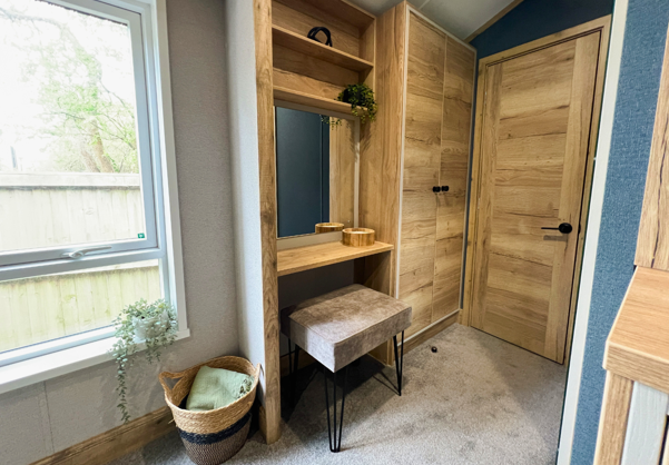 Internal of a caravan master bedroom dressing area