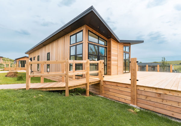 External of a luxury lodge on pitch with decking
