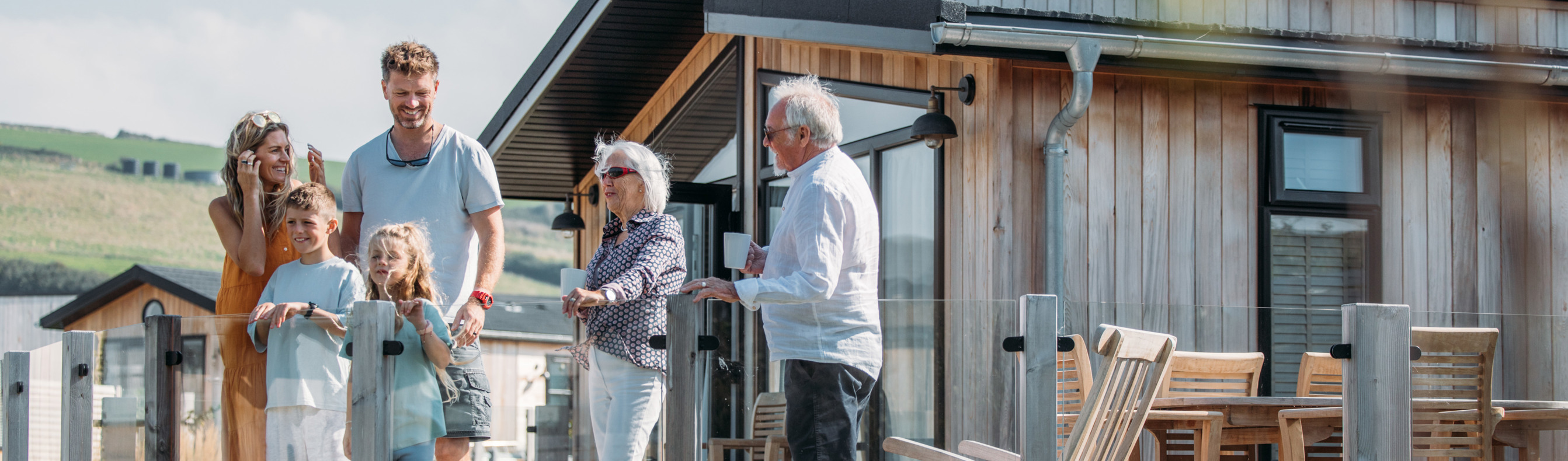 Multi-generational family gathering on deck