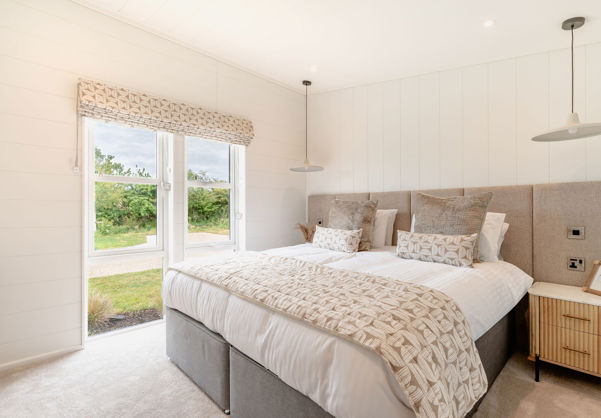 Internal of a luxury lodge master bedroom with king size bed