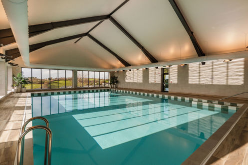 The Barn Swimming Pool with sunlight on water