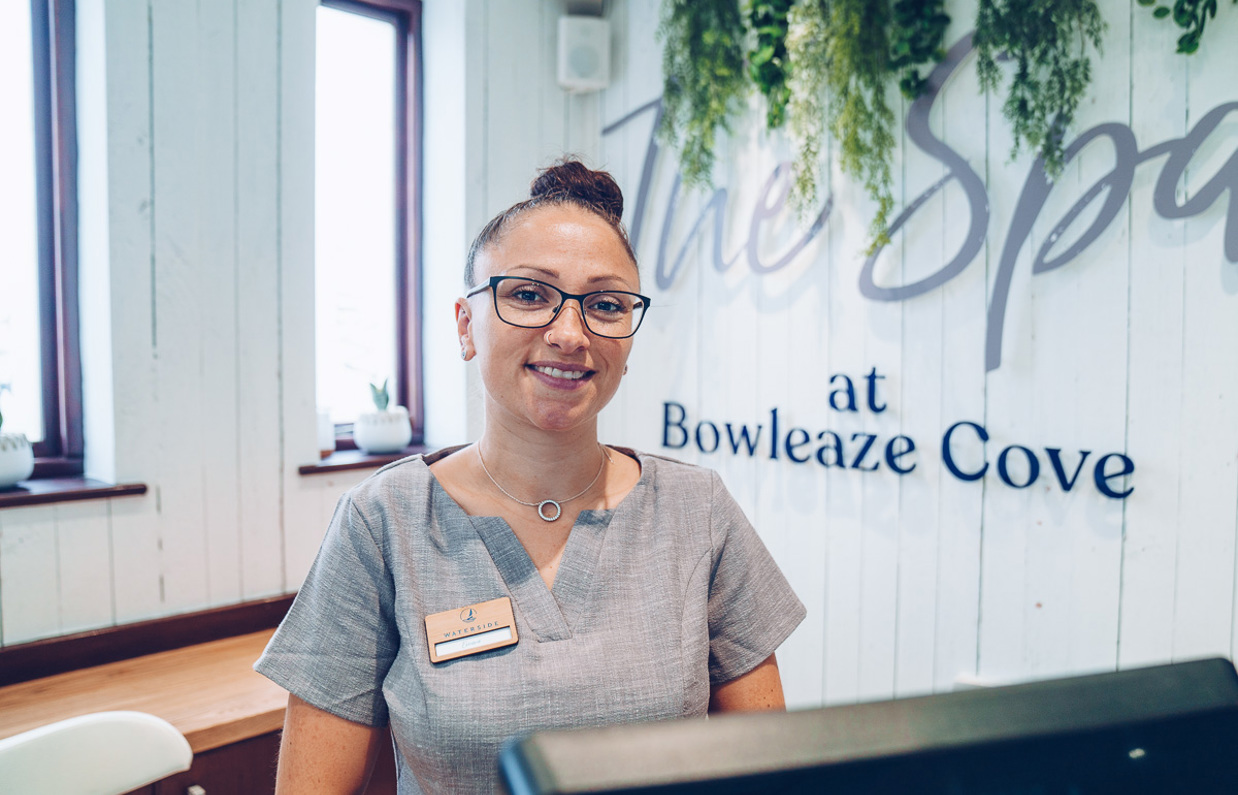 A lady at the reception of The Spa at Bowleaze Cove