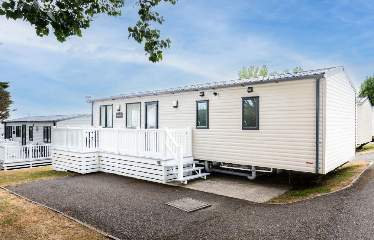 External of caravan on pitch with decking