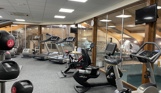 Internal of an indoor gym with various cardio and weight lifting equipment