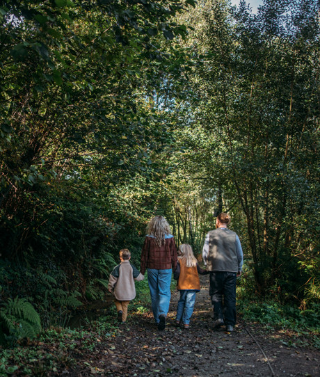 Family walk through woodland at Tregoad