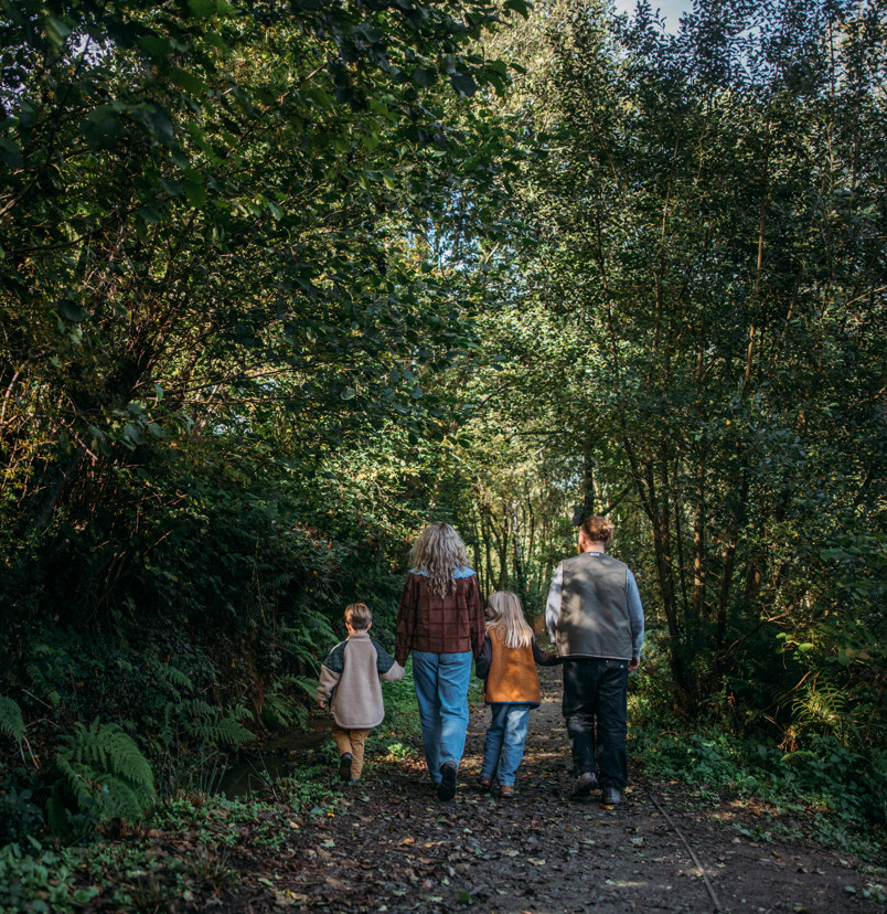 Family walk through woodland at Tregoad