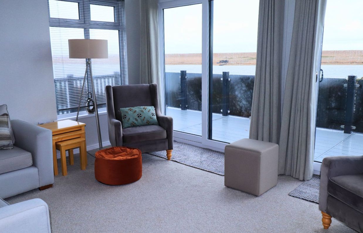 Internal of a caravan open plan lounge with seaviews