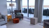 Internal of a caravan open plan lounge with seaviews